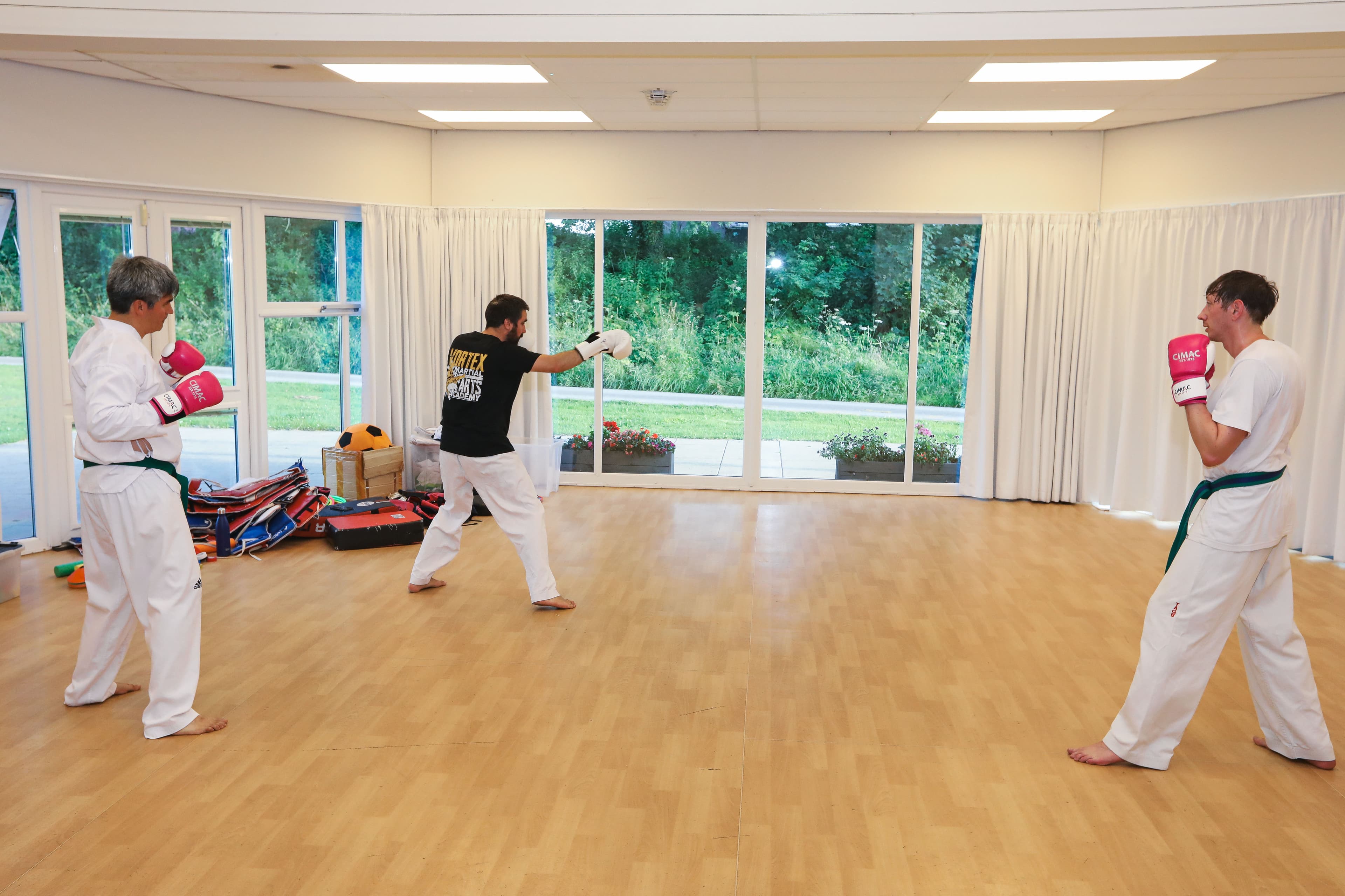 Adult students finishing a class at Vortex Martial Arts Academy in Lancaster