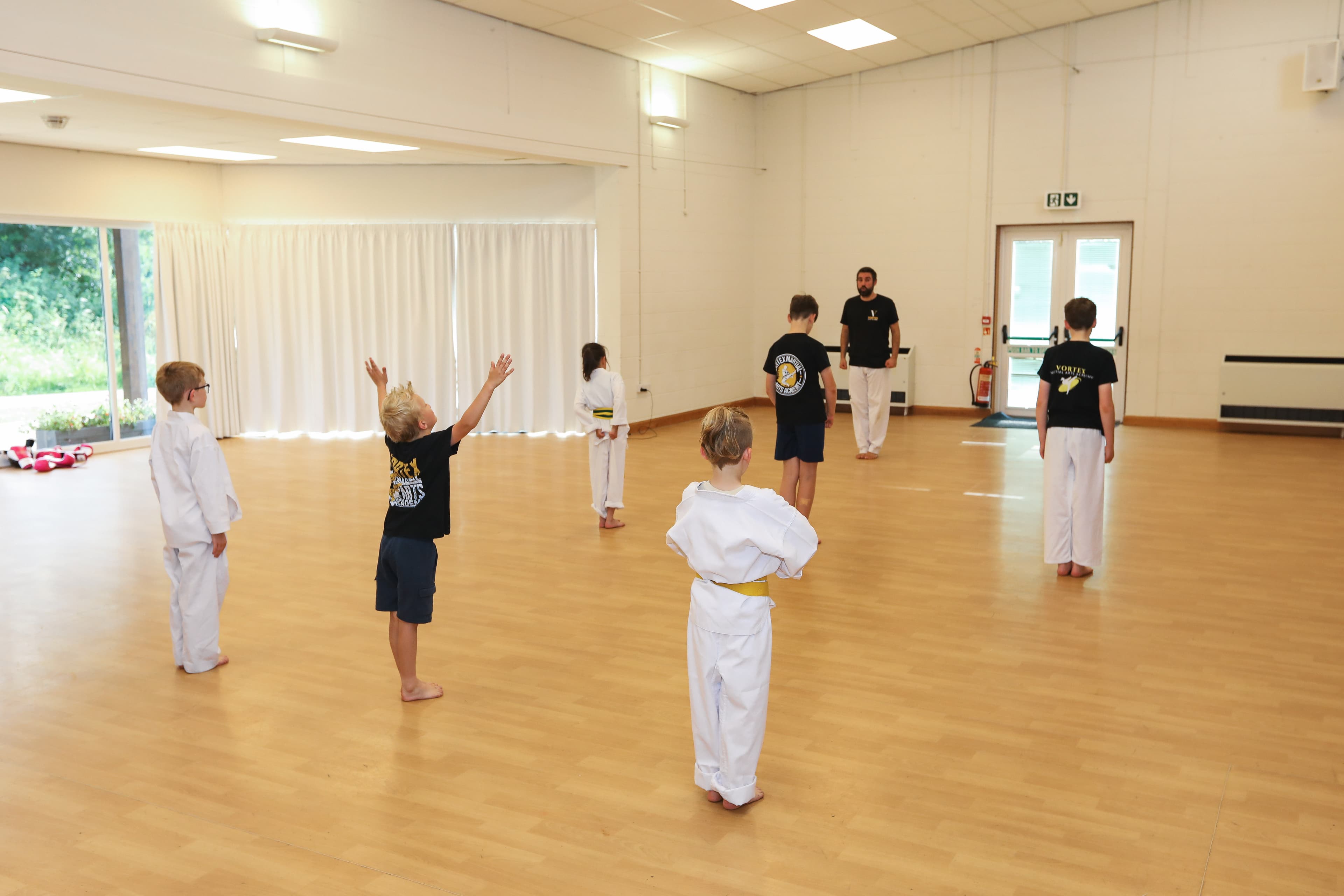 Cadets students warming up with games and movement at Vortex Martial Arts Academy in Lancaster