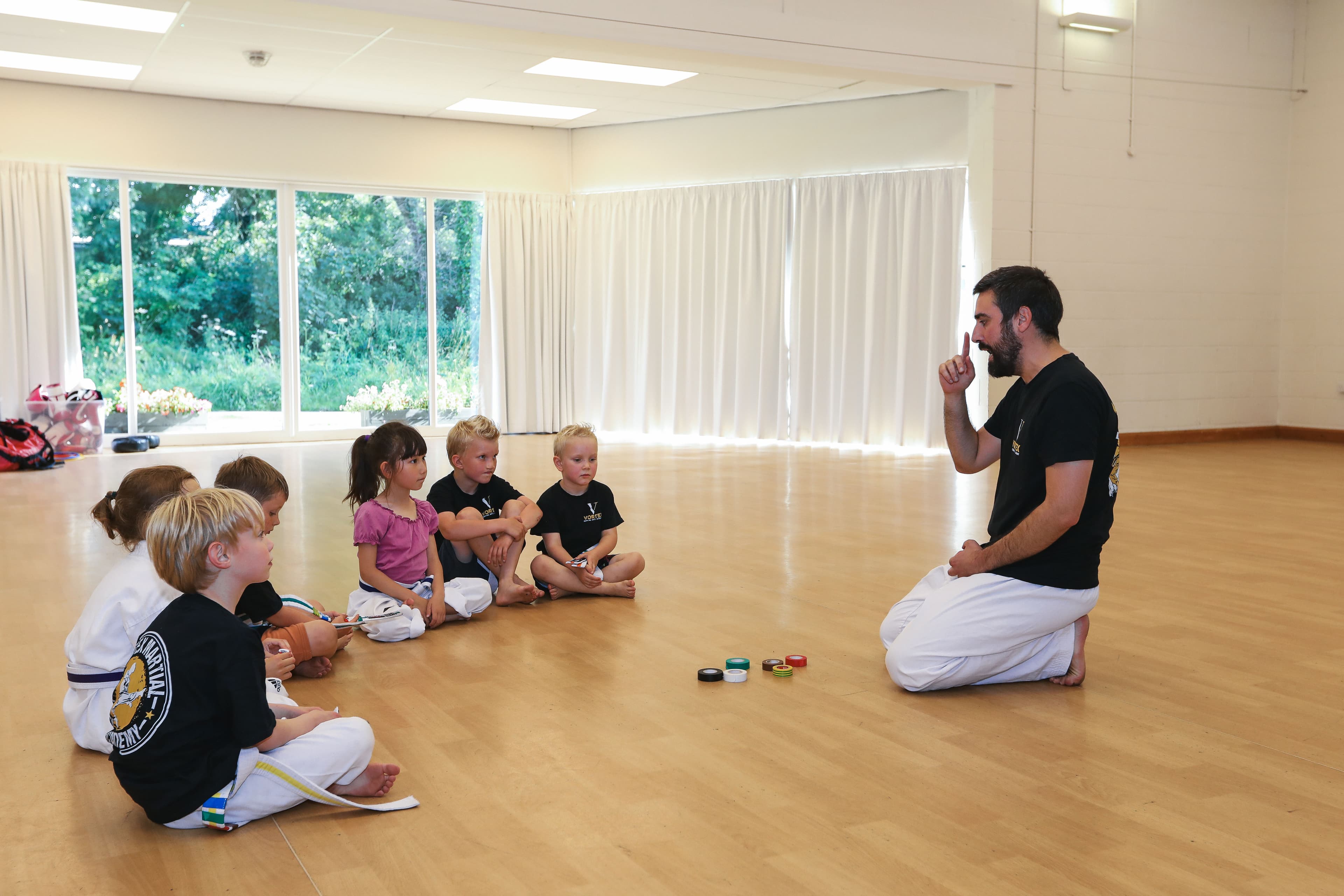 Children lining up at the start of a Dragons martial arts class at Vortex Martial Arts Academy