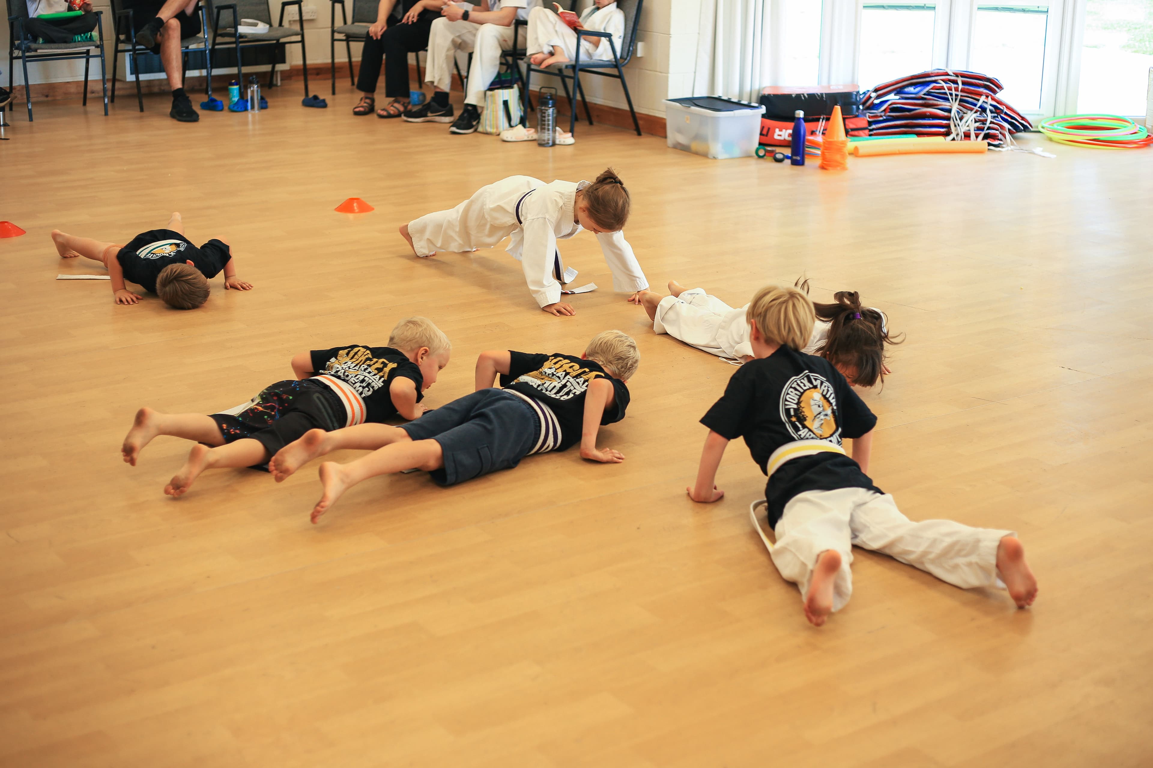Students warming up in a kickboxing class at Vortex Martial Arts Academy