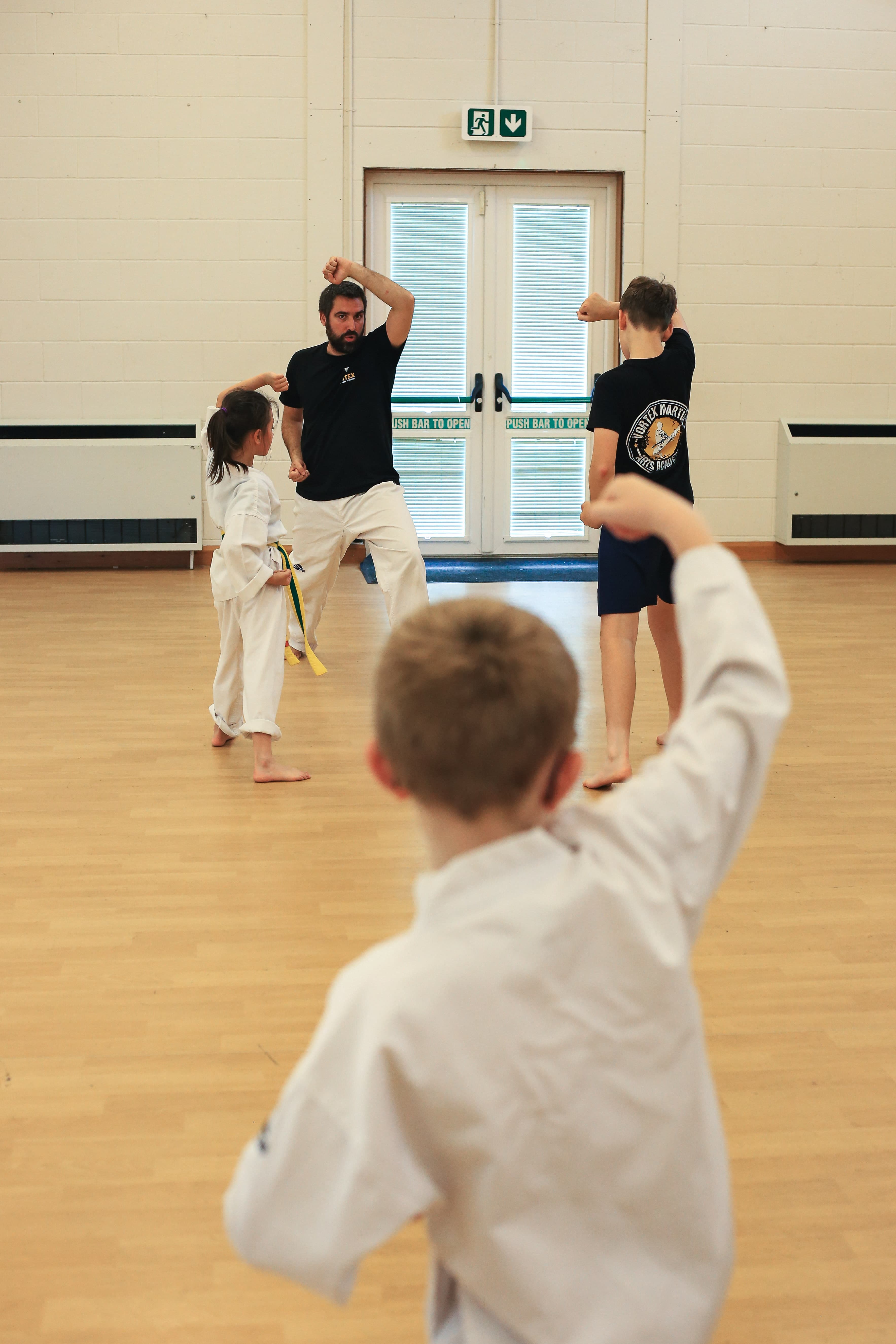 Class demonstrating stance in formation, foundational drilling at Vortex Martial Arts Academy