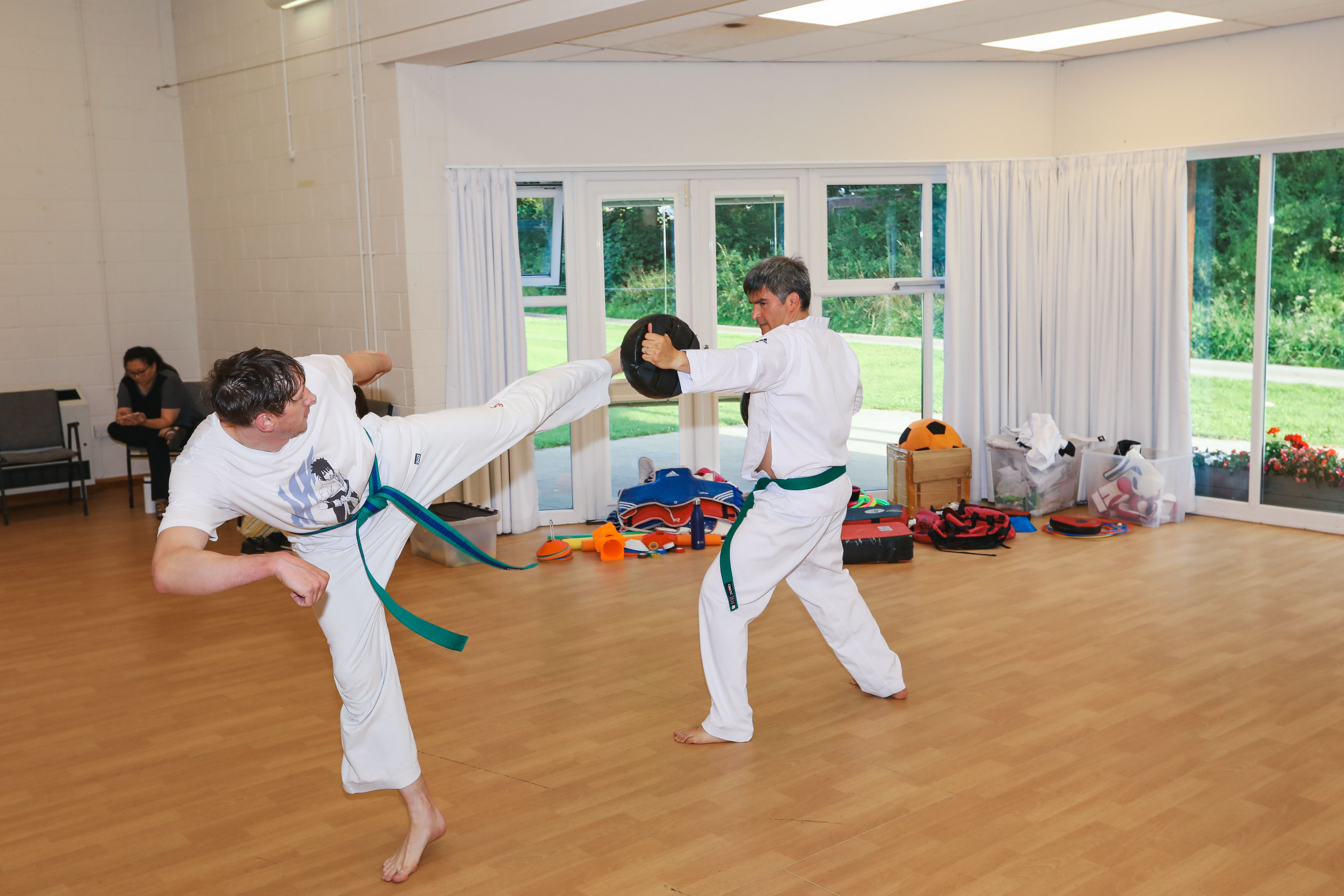 An adult demonstrating technique at Vortex Martial Arts Academy in Lancaster
